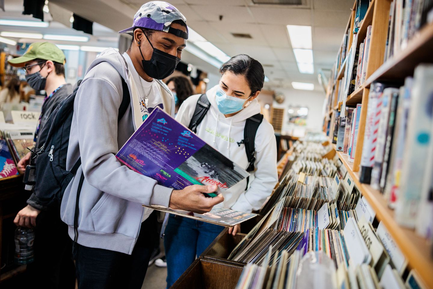 Customers look at records in a record store.